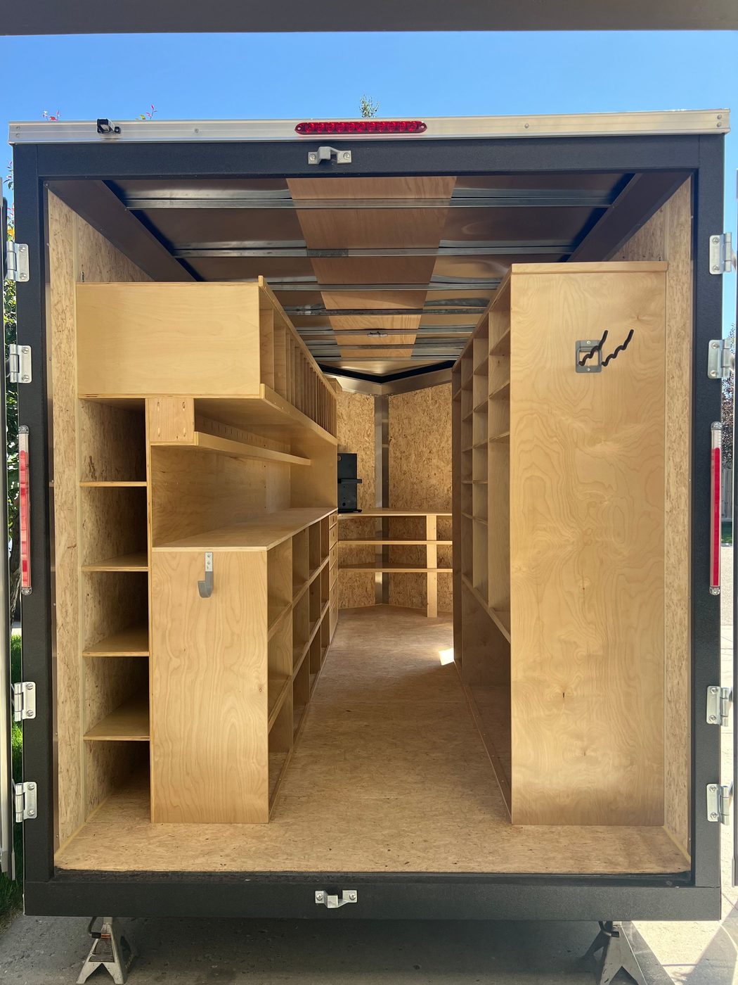 Custom plywood racking inside an enclosed trailer